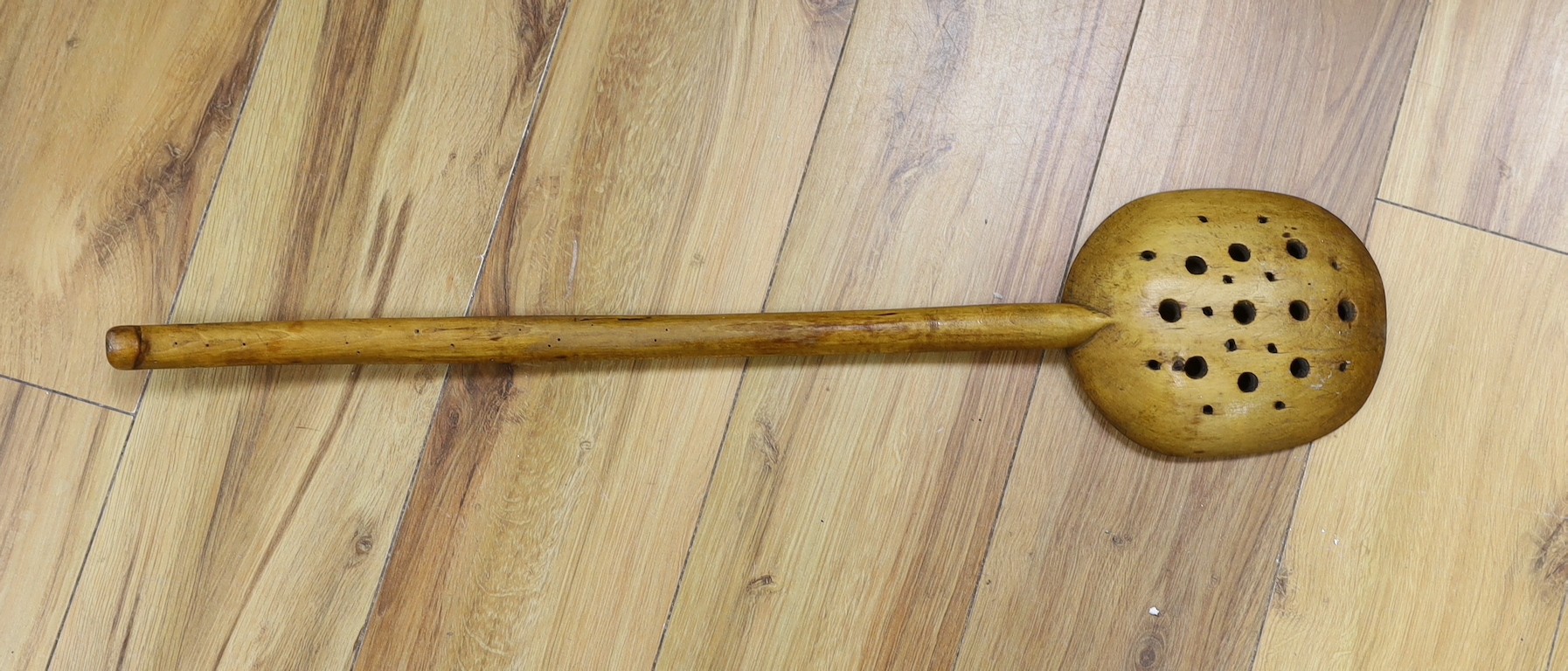 A 19th century beech jam spoon, 71cm